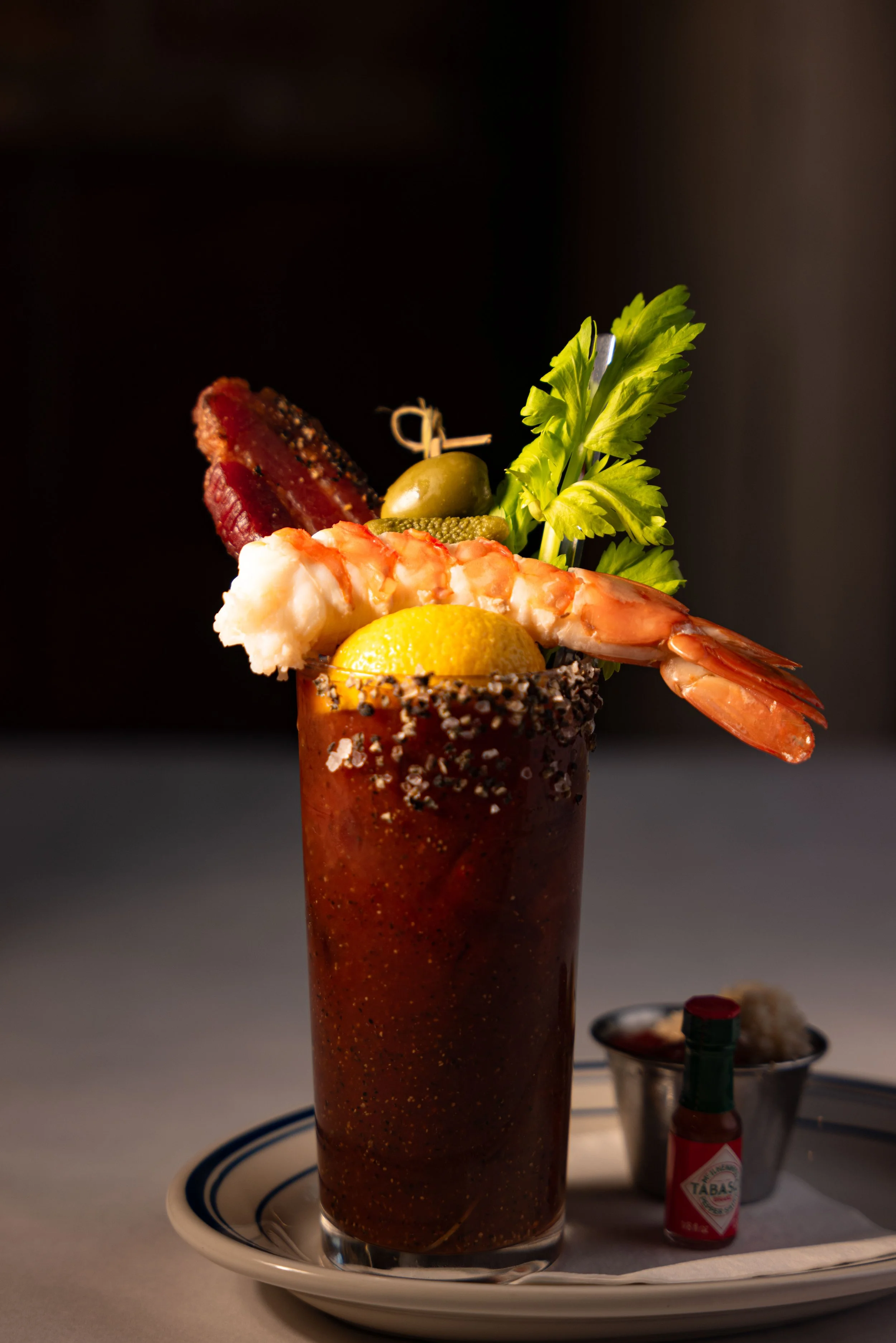 Bloody Mary with a shrimp and celery garnish