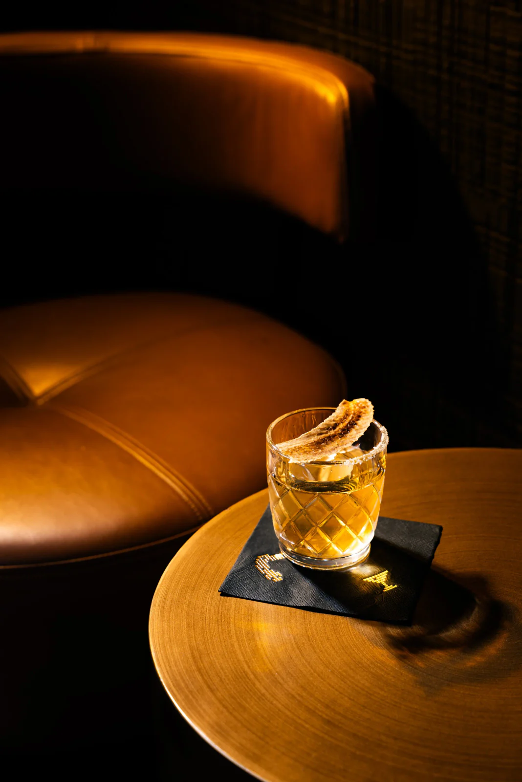 Cocktail with a citrus twist on a dark table